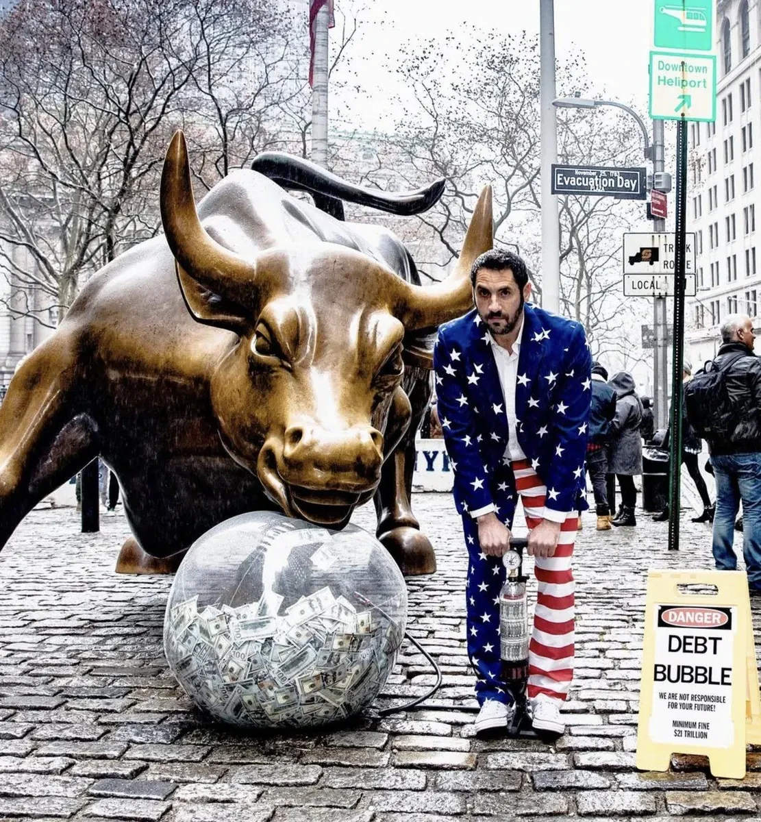 Capitalist Man — pumping the debt bubble at the Charging Bull
