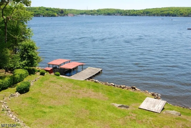 Corten Casa, 34 Byram Bay — the existing dock and boathouse from the lawn
